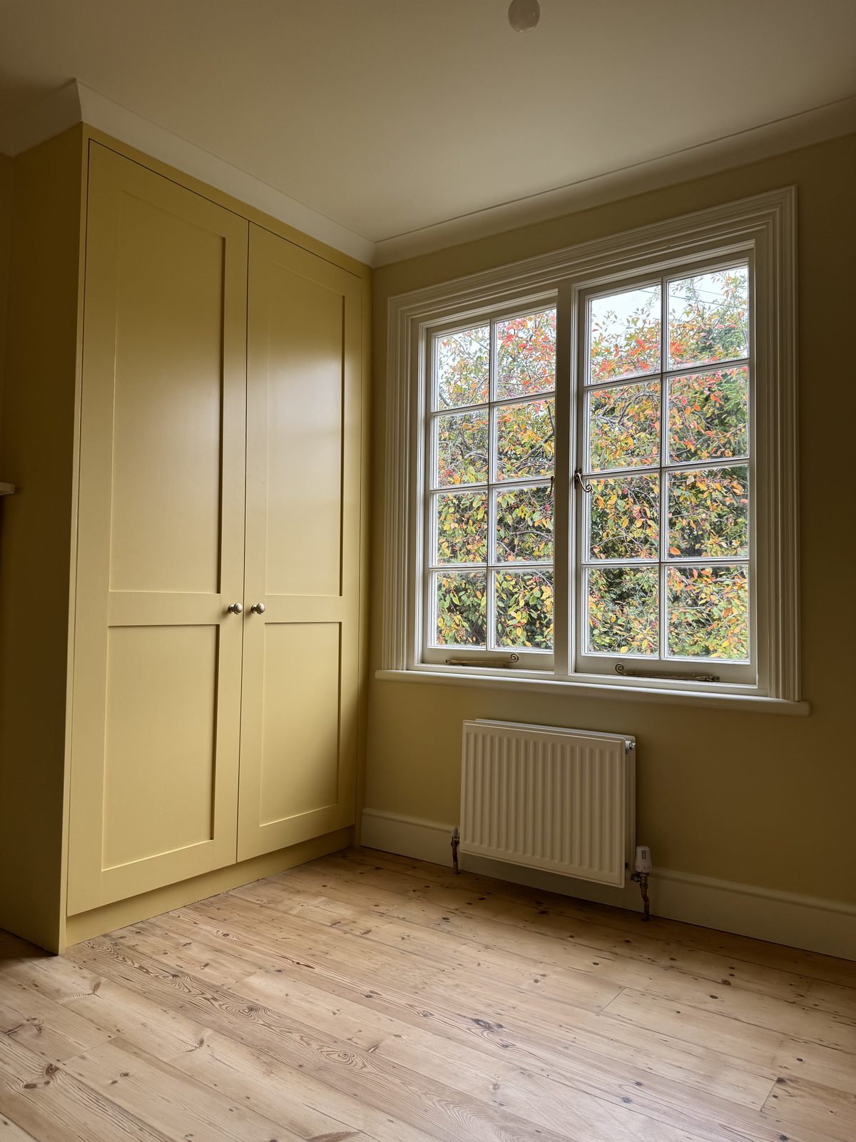 Hawthorn Cottage Limehouse — bedroom with fitted wardrobe after renovation