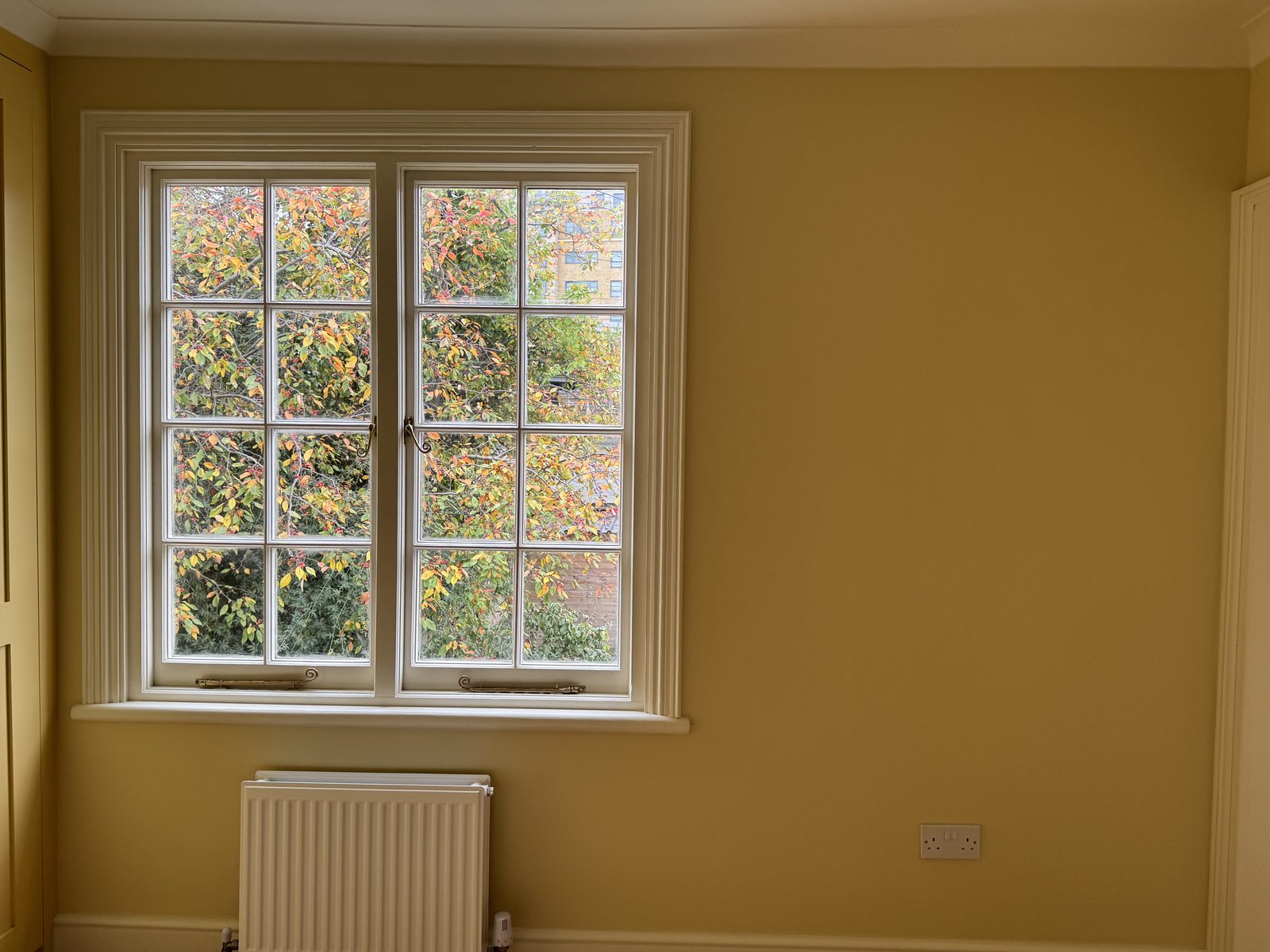 Hawthorn Cottage Limehouse — sash window with garden view after renovation by Alstruct Ltd