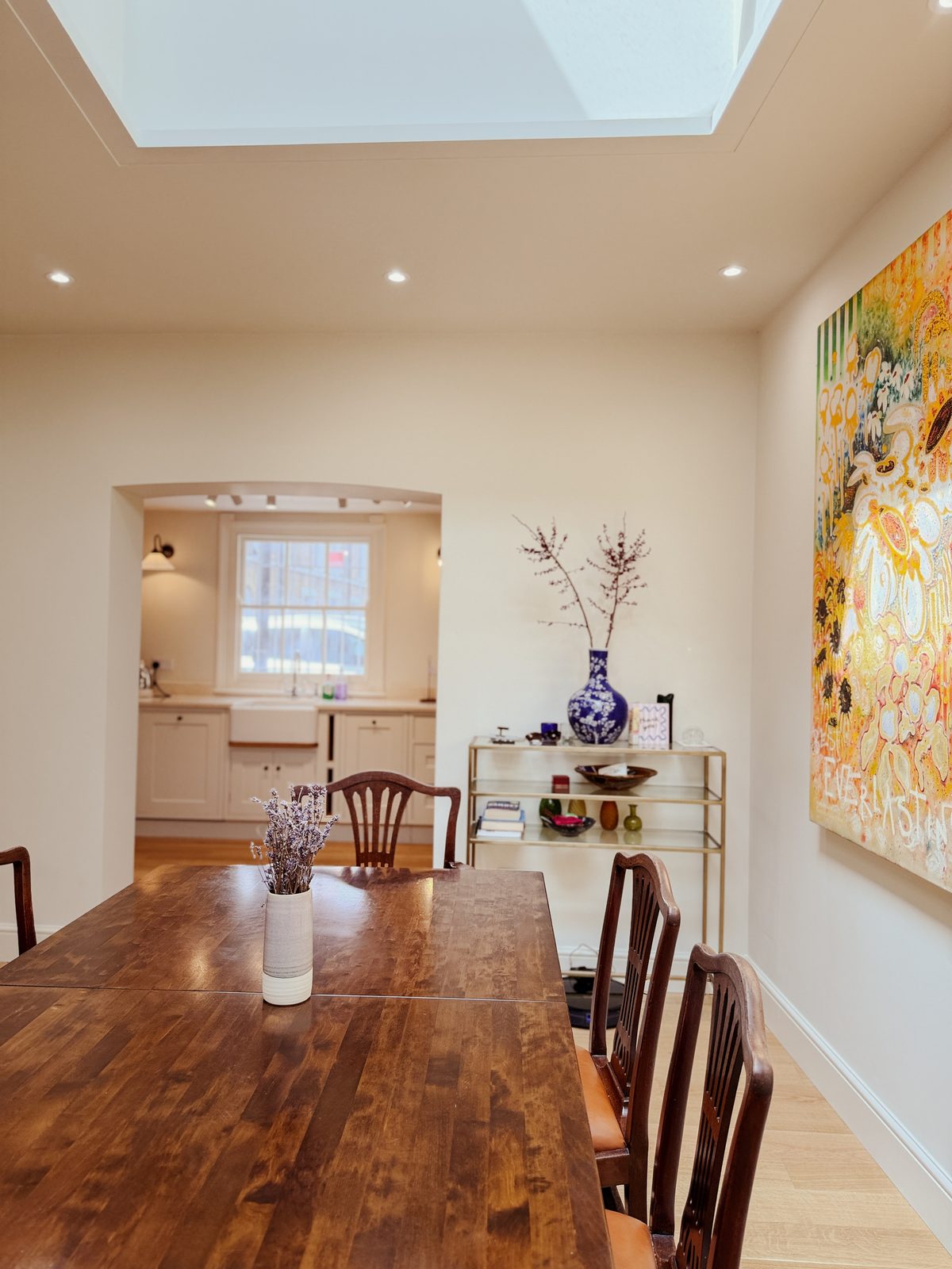 Limehouse Cottage: open-plan dining room looking through to the new kitchen after the full renovation by Alstruct Ltd