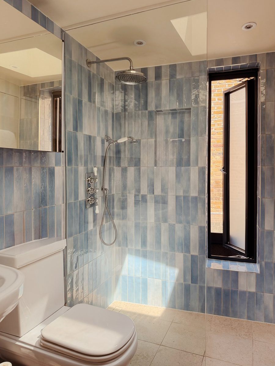 Limehouse Cottage: new shower room with blue tiles
