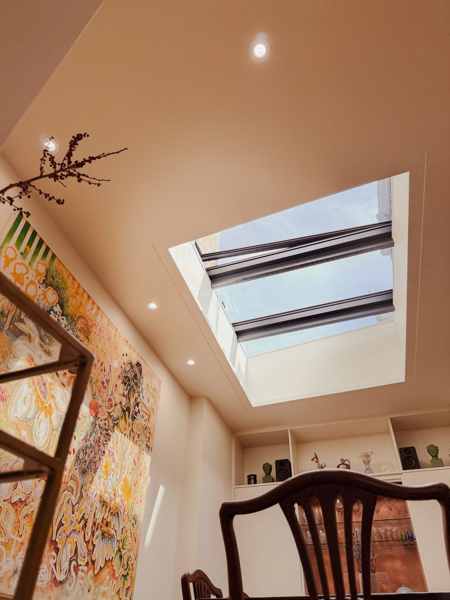 Limehouse Cottage: roof light over the dining room with the owner's artwork