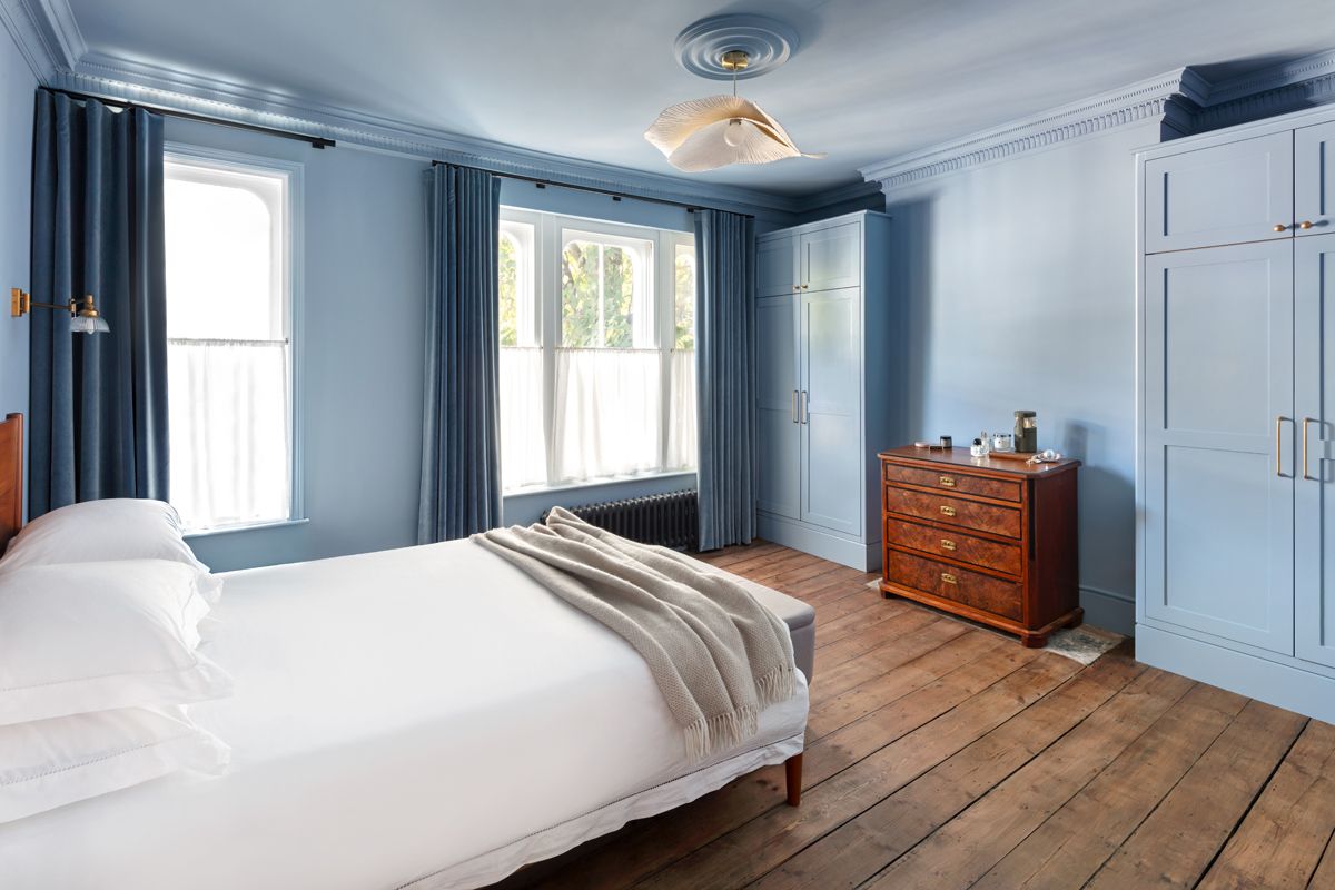 Lyal Road Bow East London — master bedroom with original floorboards and built-in wardrobes