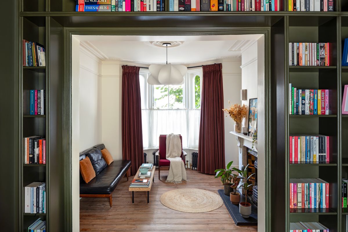 Lyal Road Bow East London — view through bespoke built-in bookshelf into living room