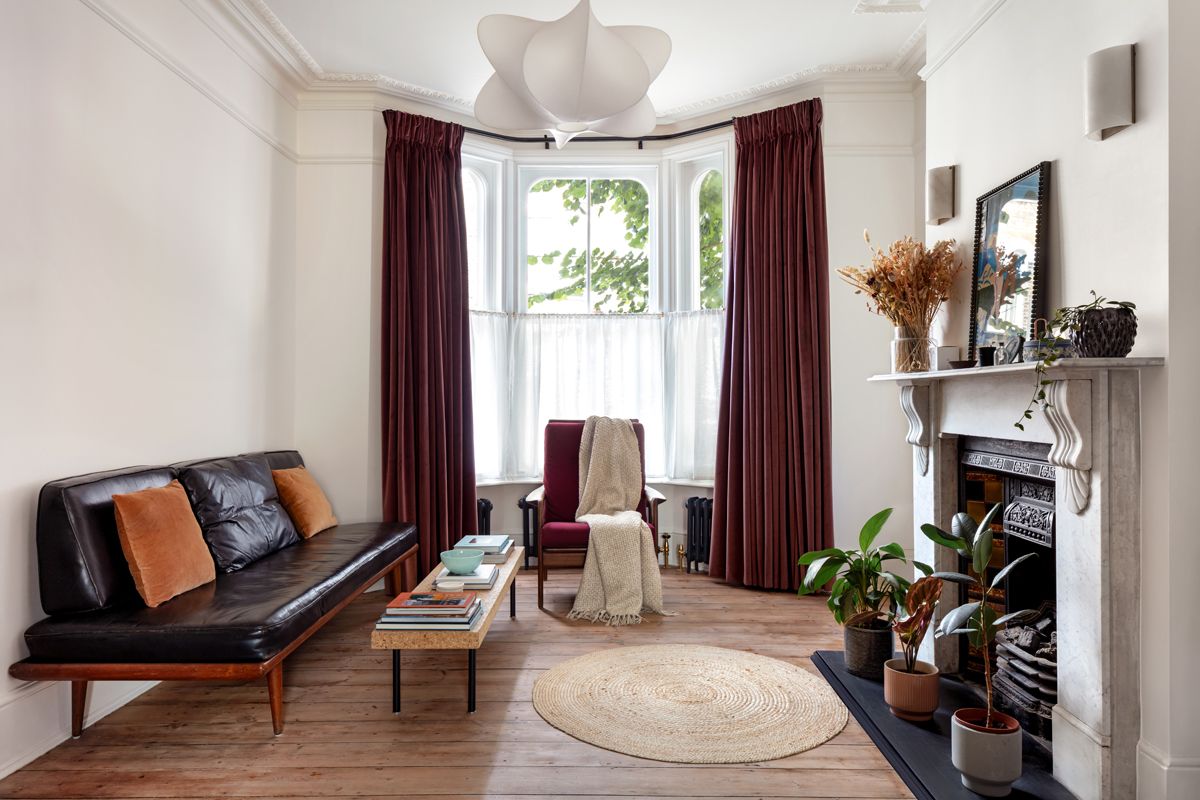 Lyal Road Bow East London — living room with restored bay window, cornicing and period fireplace