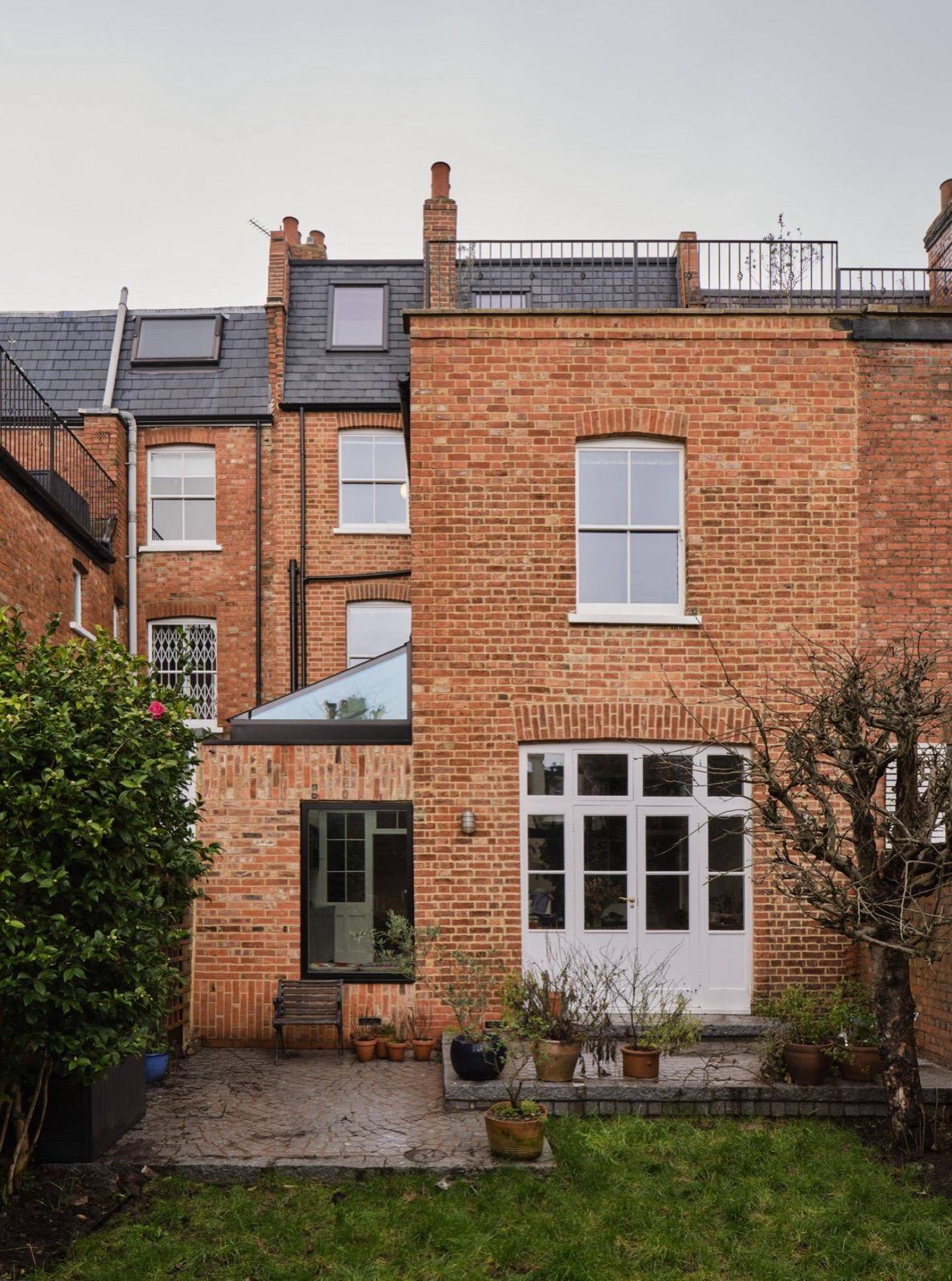 Whitehall Park Archway — rear exterior showing completed extension with glass roof