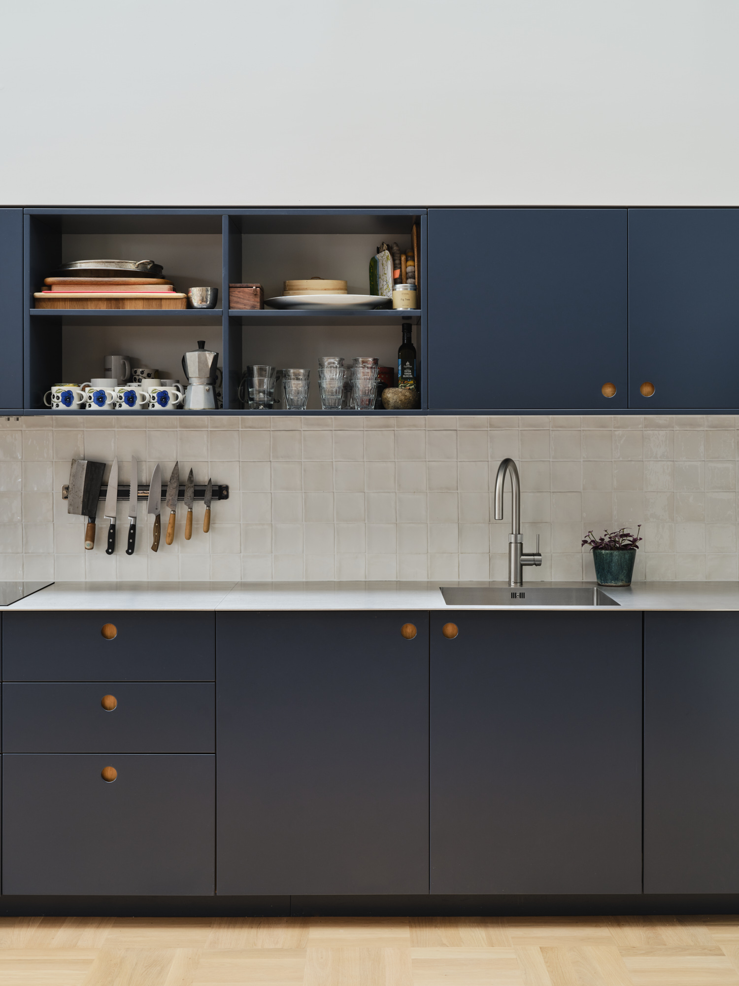 Whitehall Park Archway — kitchen detail with bespoke navy cabinetry and brass hardware