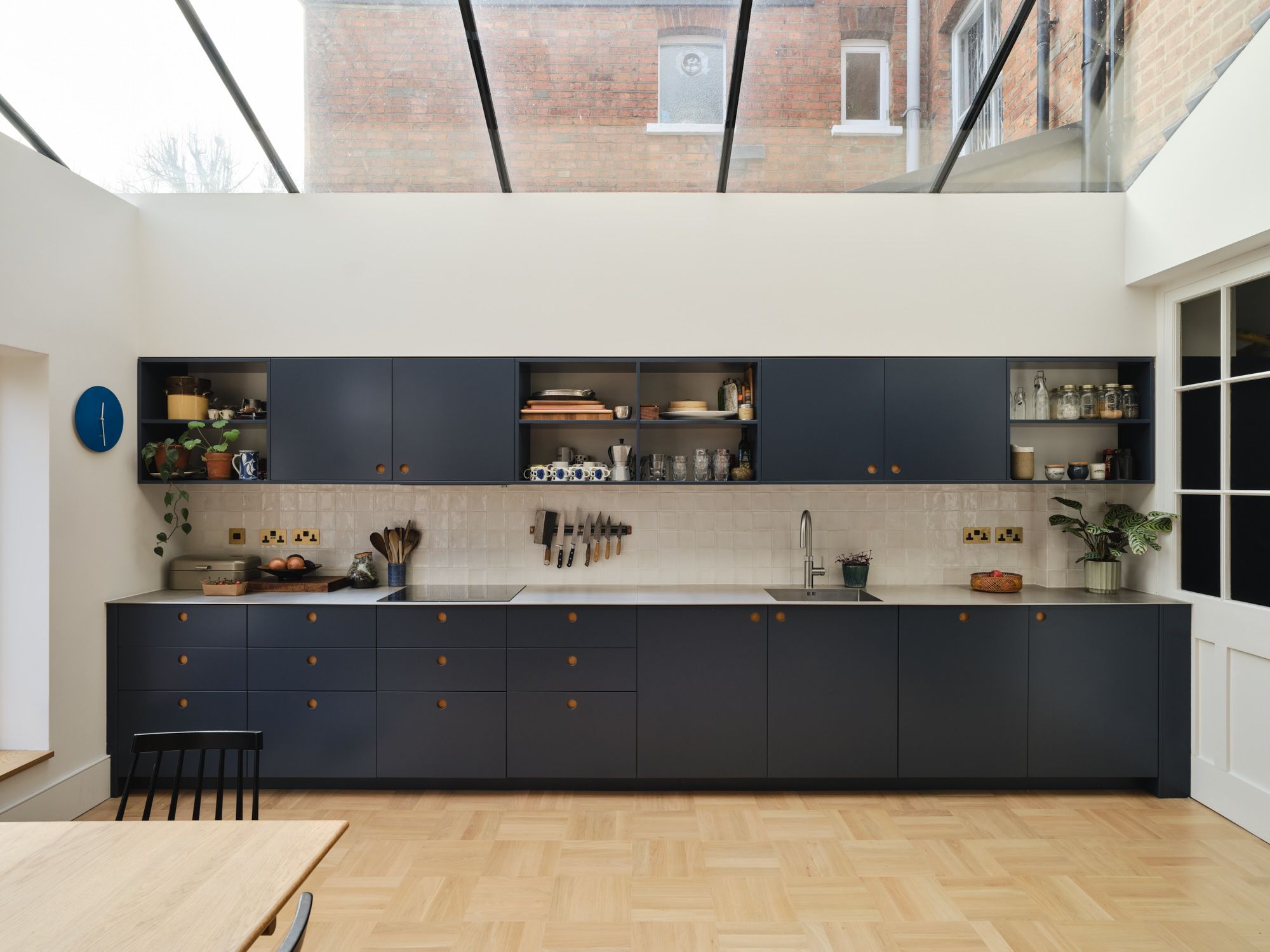 Whitehall Park Archway — new kitchen extension with glass roof, navy cabinets and dining area