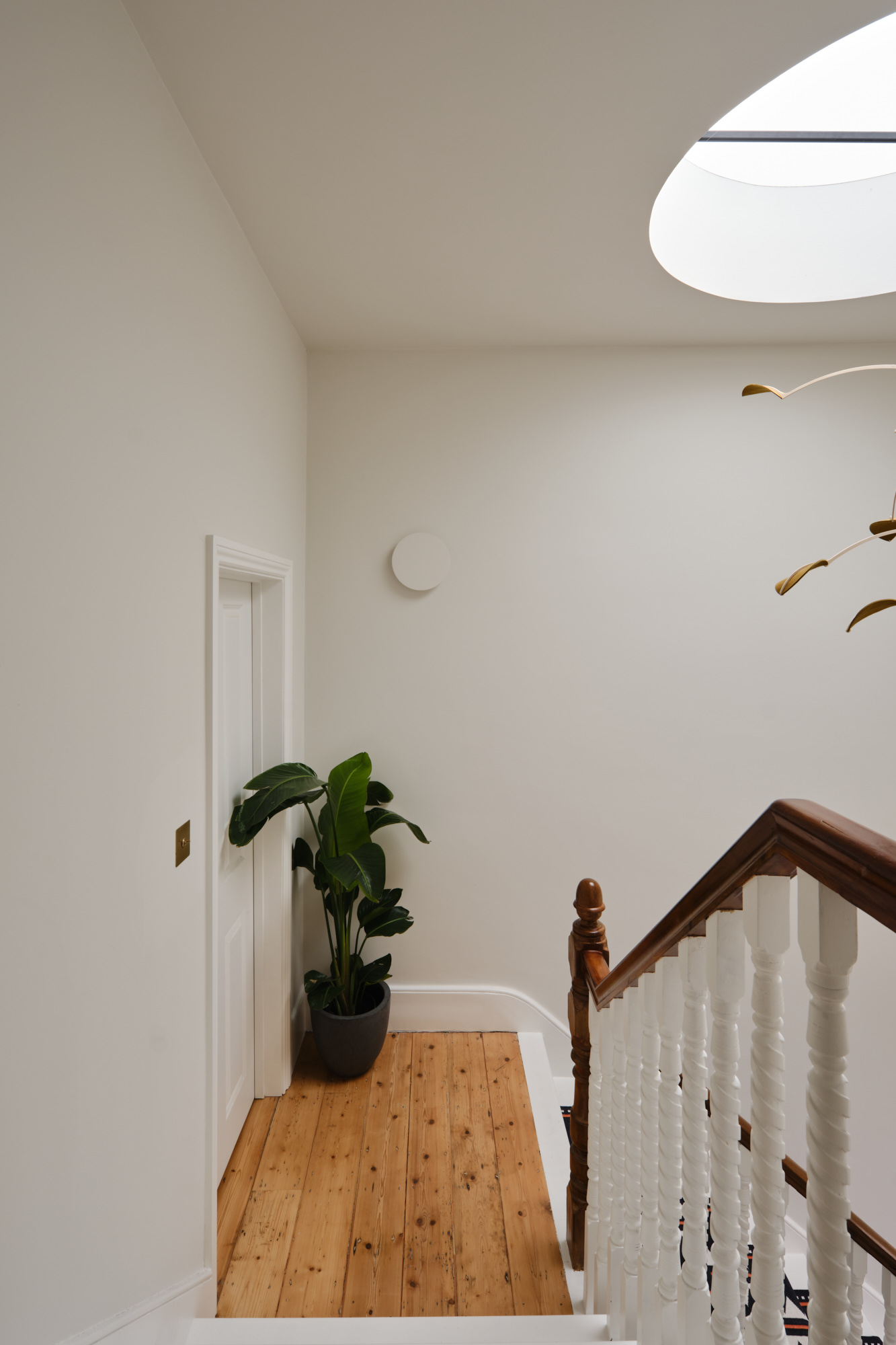 Whitehall Park Archway — staircase with circular rooflight and feature lighting